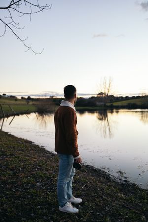 Photographer watching the sunset on a lake