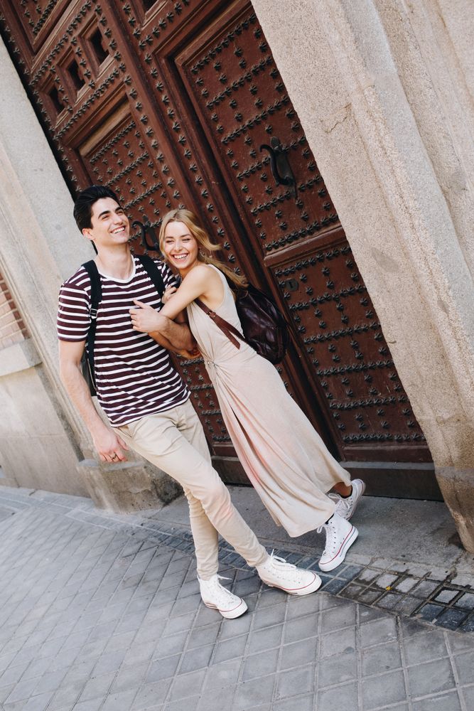 Happy couple having fun while walking in town