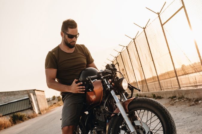 Strong man driving motorcycle