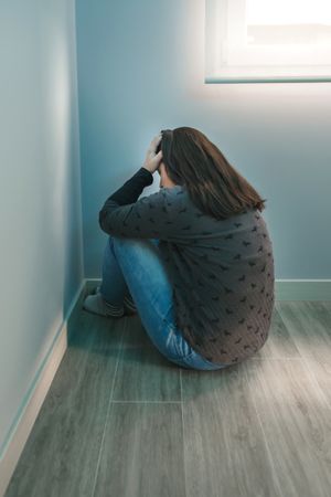 Unrecognizable woman with hands in head