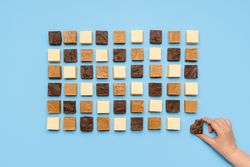 Fudge assortment symmetrically aligned on blue table