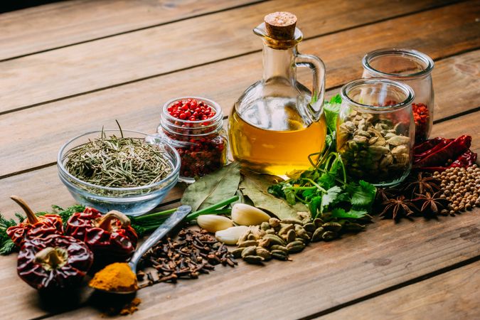 Spices and oil on table