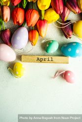 Flat lay of tulip flowers and dotted pastel eggs with space for text 48B7nq