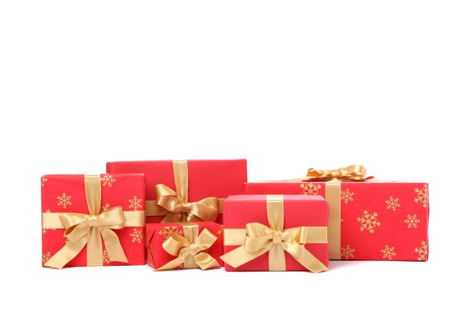 Gift boxes with golden bow isolated on blank background