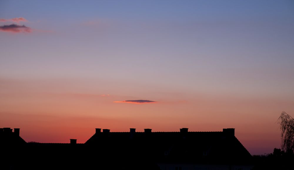 Burning red and blue sky at sunset in France
