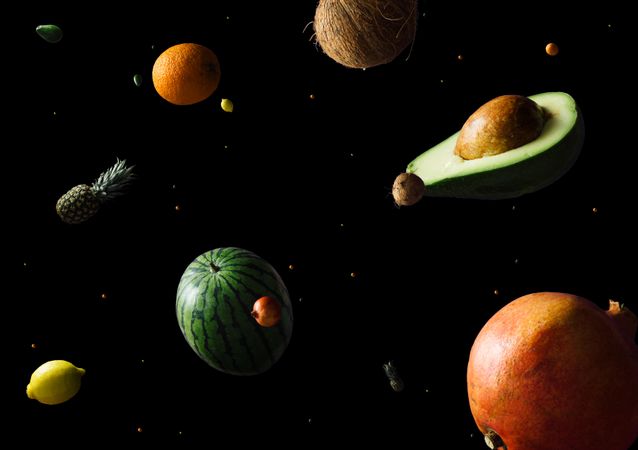 Space scene with fruits as stars and planets on dark background