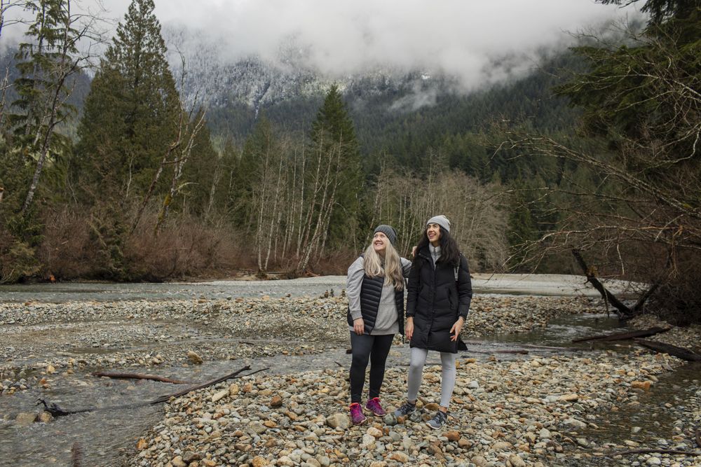 Two women looking up enjoying  mountain scenery