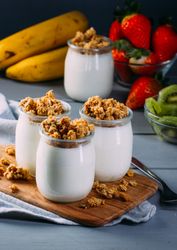 Glass bottles with milk and walnuts