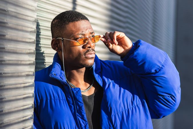 Stylish Black man in sunglasses on street