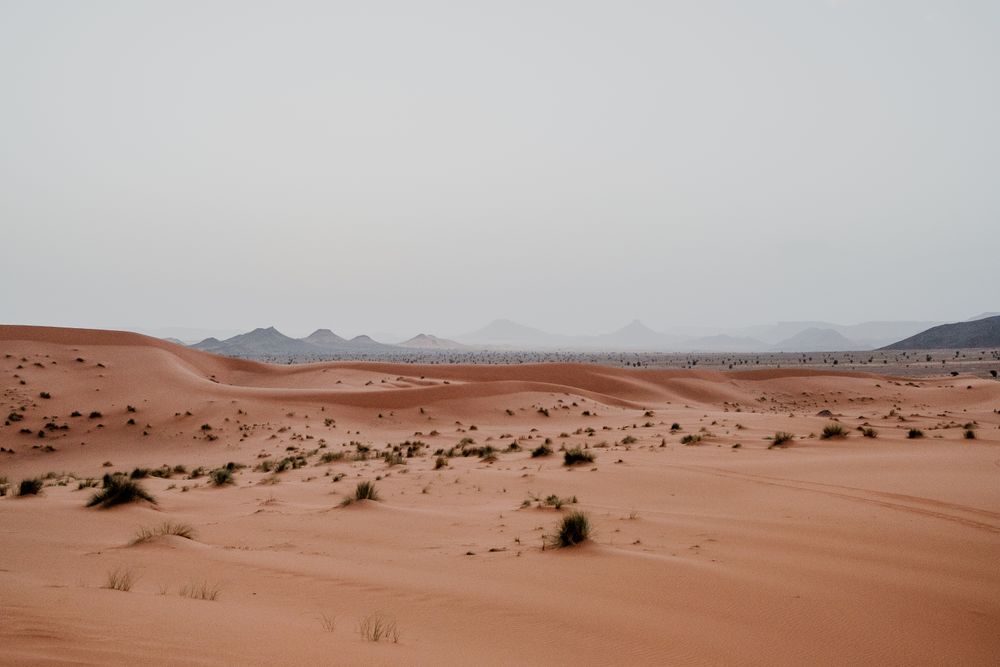 Sunset sky over hills in desert