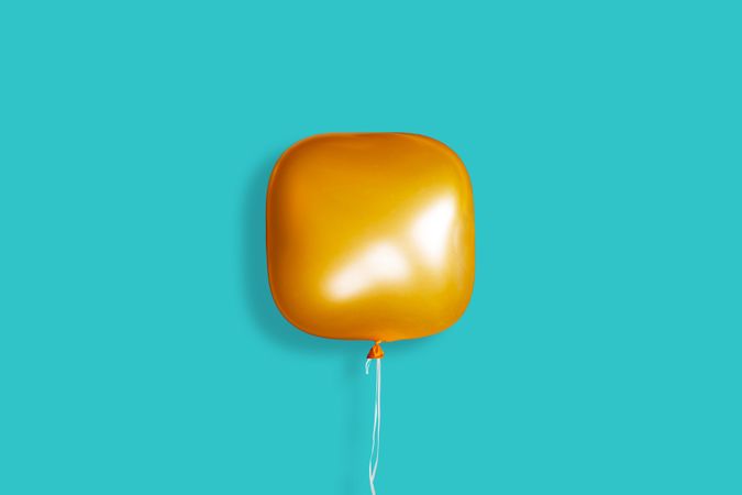 A single square orange balloon