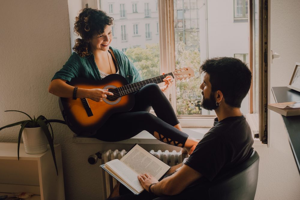 Cheerful couple spending time together at home