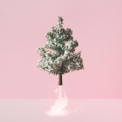 Christmas tree blasting off with fireworks emerging from base