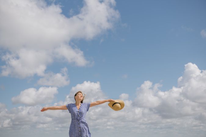 Happy young woman enjoying breeze