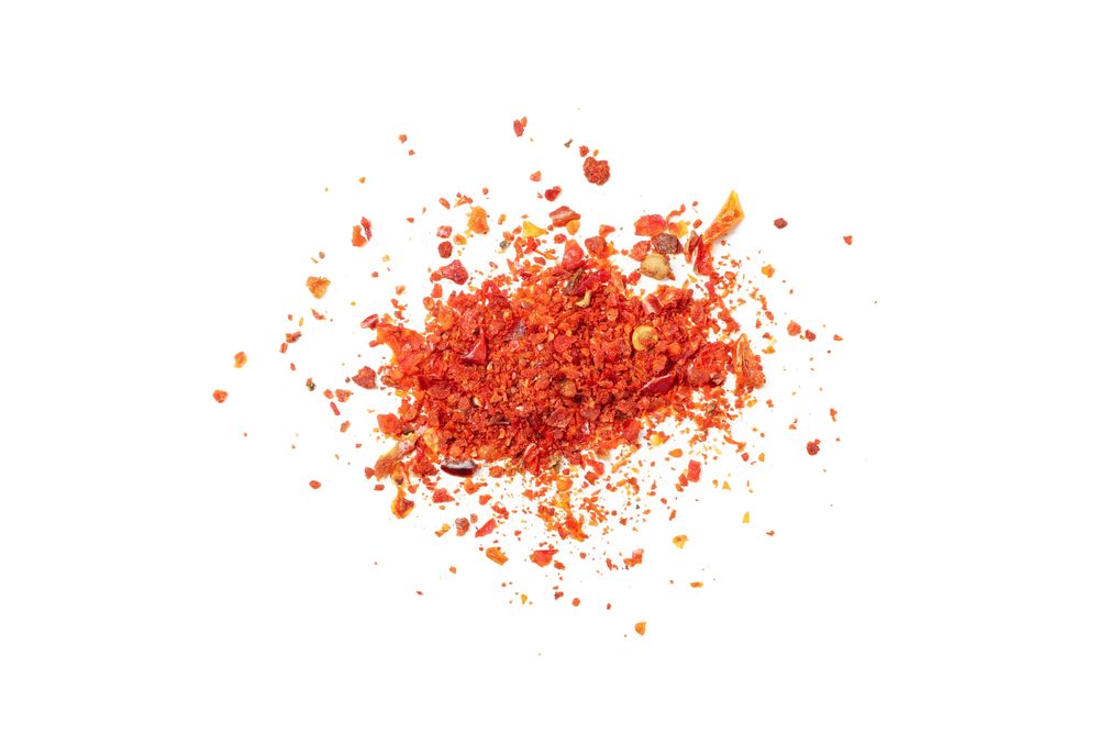 Bunch of pepper powder spice isolated on plain background
