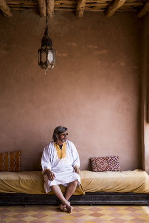 Man sitting on oriental stone terrace