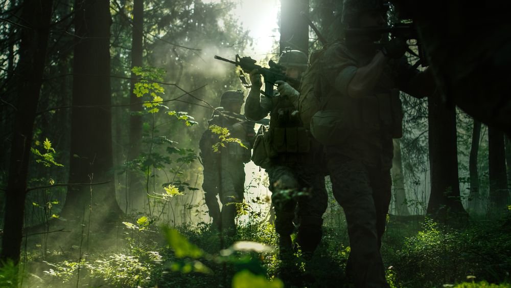 Squad of Five Fully Equipped Soldiers in Camouflage on a Reconnaissance Military Mission