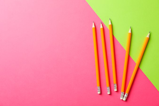 Pencils on two tone background, space for text