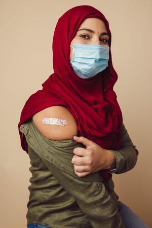 Portrait of Islamic female with covid-19 vaccine