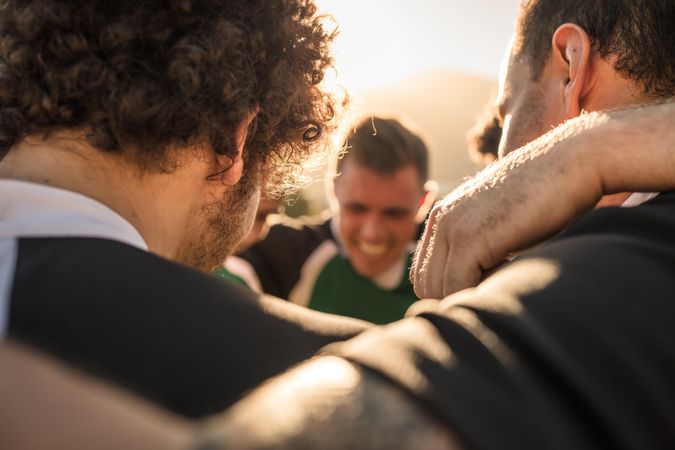 Close up of rugby players standing in a huddle