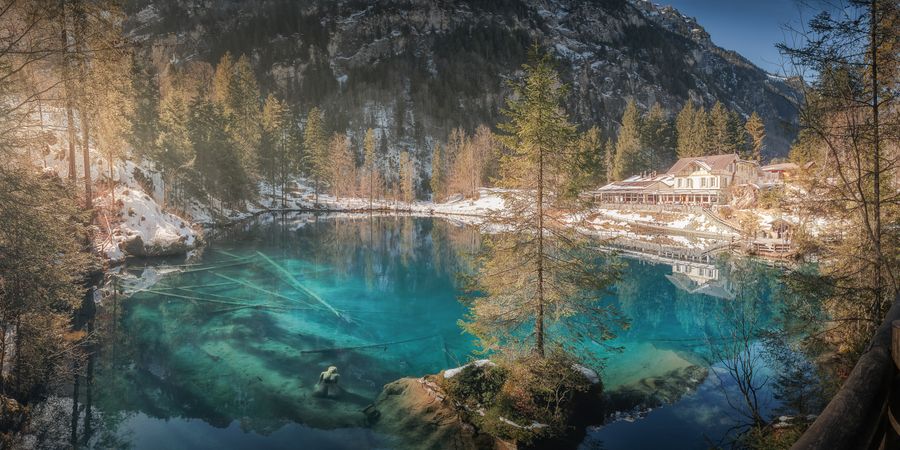 Tranquil blue lake in snowy mountains
