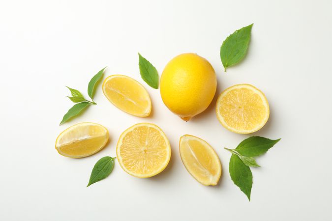Fresh lemons on light background, top view. Ripe fruit