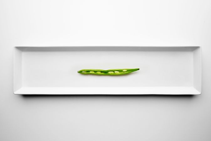 Halved green bean on appetizer plate