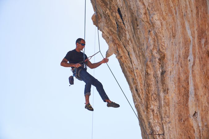 Mountaineer descending from mountain slope