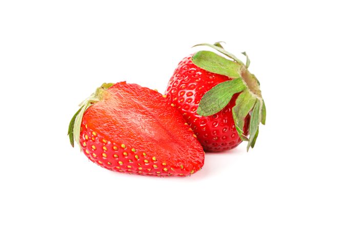 Strawberries isolated on light background. Summer sweet fruits and berries