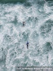 Two surfers in the ocean water bxa7X0