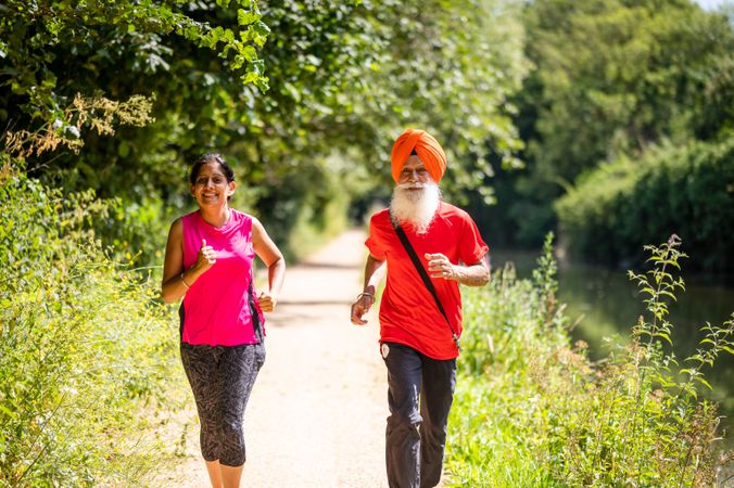 Mature Sikh couple jogging