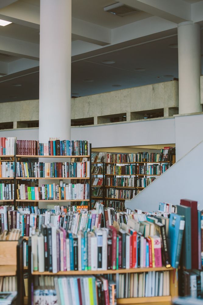 Bookshelves in library during daytime