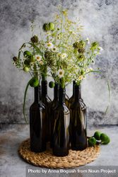 Wine bottles vases full of daisy flowers 4d8BYD