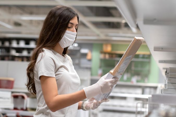 Woman in homeware store wearing surgical mask