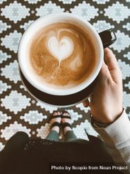 Heart shaped latte art inside coffee mug bDAKV0