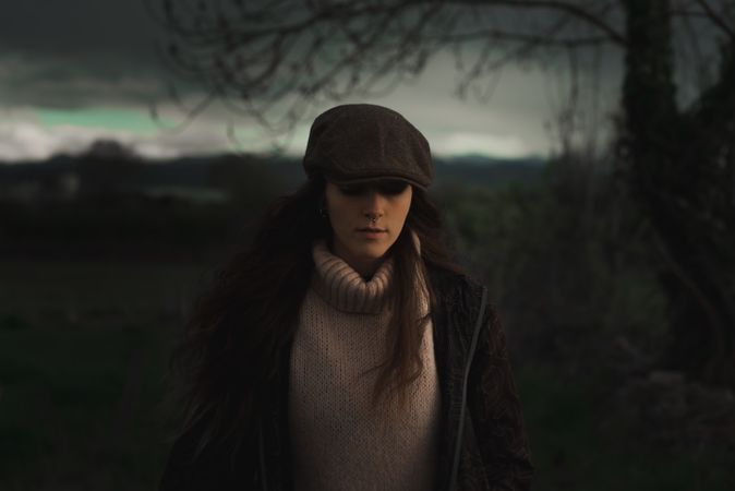 Young woman in warm clothes in forest