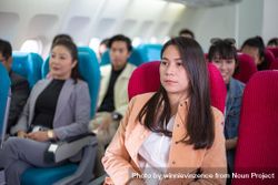 People sitting on airplane 47AaA0