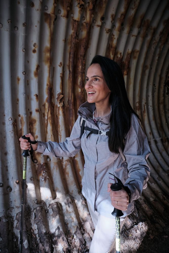 Positive Hispanic hiker in desolated tunnel