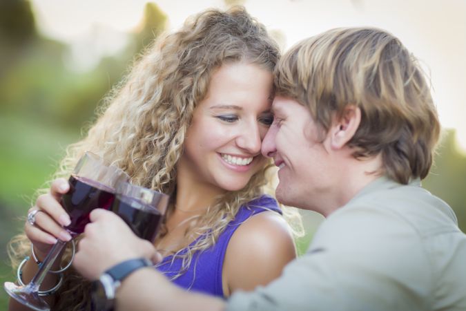 A Man and Woman Enjoying A Glass Of Wine in the Park