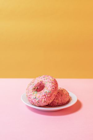 Pink doughnuts in a colorful background