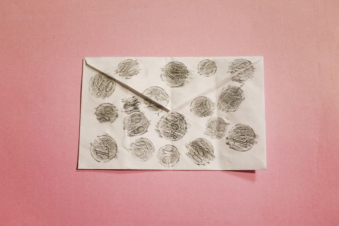 Outline of coins on envelope