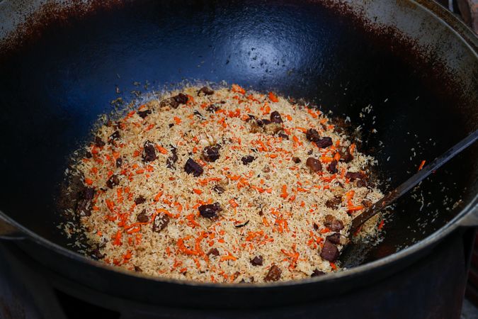 Pilaf cooking on a fire.
