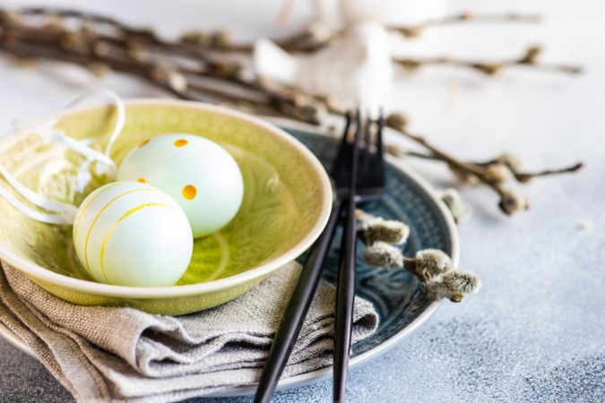 Easter holiday concept with eggs in yellow bowl