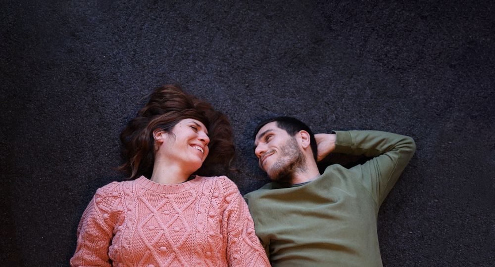 Smiling companions sharing a tender moment on Valentine's Day