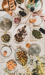 Flat-lay of Mediterranean table setting, with glassware, vertical