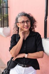 Portrait of an elegant businesswoman outdoors, looking at the camera.