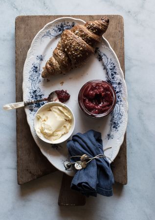Served breakfast meal with sandwich and jam