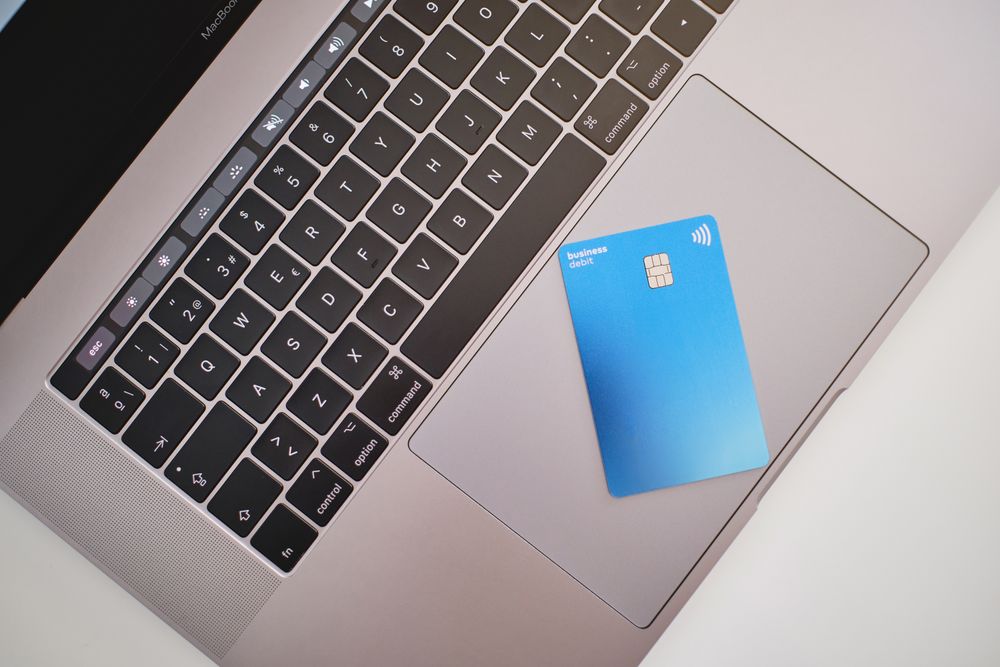 Business debit card on laptop tracker