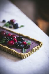 Fresh blueberry pistachio cake with whole berries on top