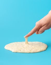 Sourdough starter isolated on blue background